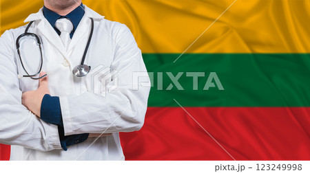 Male Doctor With Stethoscope On Lithuanian Flag. Doctor Holding Stethoscope On Lithuanian Flag 123249998