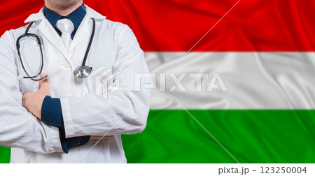 Male Doctor With Stethoscope On Hungary Flag. Doctor Holding Stethoscope On Hungary Flag 123250004