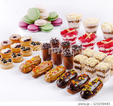 Colorful dessert display featuring assorted pastries and sweets Colorful dessert display featuring assorted pastries and sweets 123250485