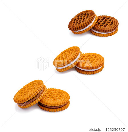 Delightful orange cream-filled cookies stacked for a tasty treat Delightful orange cream-filled cookies stacked for a tasty treat 123250707