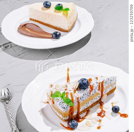 Delicious cheesecake dessert served on elegant plates Delicious cheesecake dessert served on elegant plates 123250709