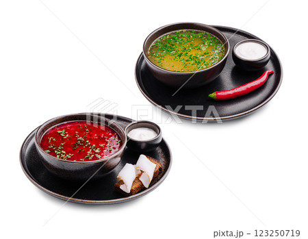 Delicious bowls of fresh soups served with sides 123250719