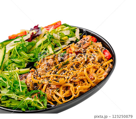 Delicious vegetable and noodle dish served in a black bowl Delicious vegetable and noodle dish served in a black bowl 123250879