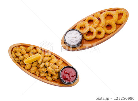 Deliciously prepared fried appetizers served on wooden platters 123250980