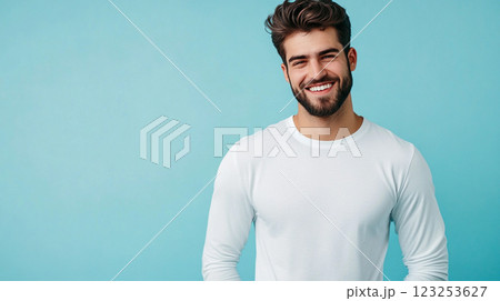 Handsome man smiling in a bright studio, exuding happiness and confidence against a simple backdrop. Modern style and a great expression. 123253627