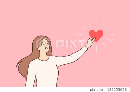 Woman holds heart symbolizing love and mercy, calling for assistance to charitable organizations 123255628