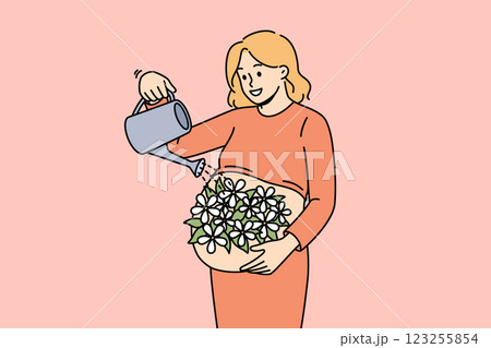 Pregnant woman takes care of future child by watering belly with flowers as sign of love 123255854