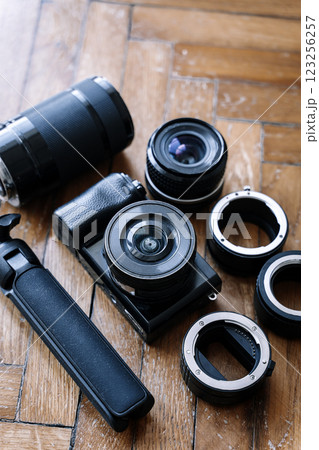 Camera Lenses Equipment background. Photography technology stuff on wooden background. Camera Lenses Equipment background. Photography technology stuff on wooden background. 123256257