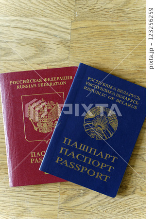 Belarusian and Russian passport. Citizenship of Russia and Belarus. Emigration, travel, work concept 123256259