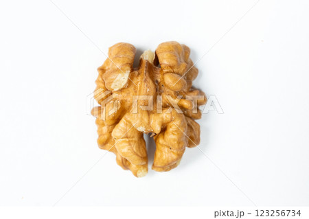 Macro peeled walnut, kernel, white isolate background, top view. Macro peeled walnut, kernel, white isolate background, top view. 123256734