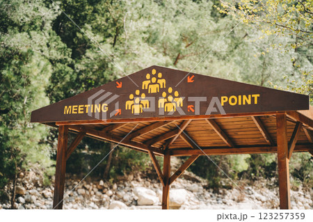 Community meeting point wooden hut in the mountains. Ecological design for safety equipment construction - assembly gathering location station Community meeting point wooden hut in the mountains. Ecological design for safety equipment construction - assembly gathering location station 123257359