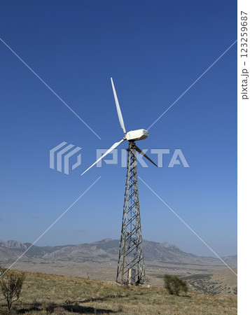 Wind turbines and green mountain nature landscape near the sea. Green energy concept. aerial view. 123259687