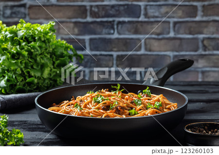 vegan whole grain pasta alla puttanesca, close-up vegan whole grain pasta alla puttanesca, close-up 123260103