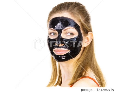 Woman with black peel off mask on face 123260519