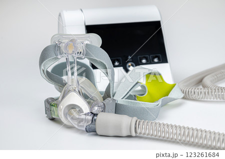 Continuous positive airway pressure system includes of CPAP machine, mask, tube on white background. 123261684