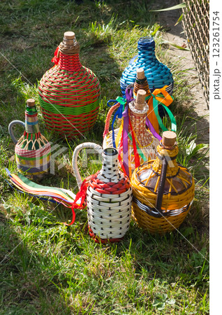 Decorated demijohns. Traditional vessels for wine and other drinks that are also used at folk festivals. South Moravia, Czech Republic. Decorated demijohns. Traditional vessels for wine and other drinks that are also used at folk festivals. South Moravia, Czech Republic. 123261754