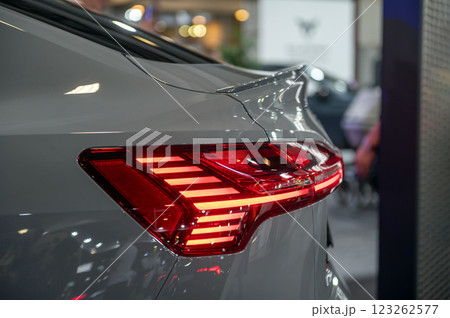 Rear red stop signal lamp on a modern car. Close-up. Selective focus. 123262577