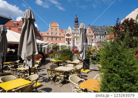 View of Tirgonu Street and medieval buildings through an outdoor cafe, Riga old town, Latvia. View of Tirgonu Street and medieval buildings through an outdoor cafe, Riga old town, Latvia. 123263079