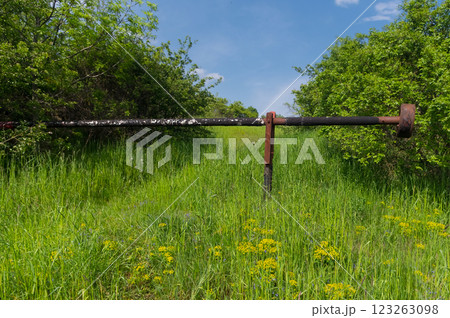 A old roadblock that has been lifted. A reminder of the past. A old roadblock that has been lifted. A reminder of the past. 123263098