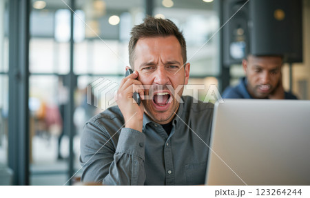 Stressed office worker shouting on phone, uncomfortable office atmosphere, tense business meeting, loud conversation, workplace conflict, professional frustration, business stress, office tension Stressed office worker shouting on phone, uncomfortable office atmosphere, tense business meeting, loud conversation, workplace conflict, professional frustration, business stress, office tension 123264244