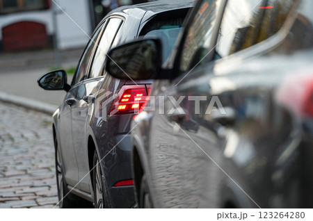 Cars parked in a row on a city street side Cars parked in a row on a city street side 123264280