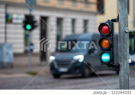 traffic light on the street junction with beautiful bokeh, city with cars in the background 123264281