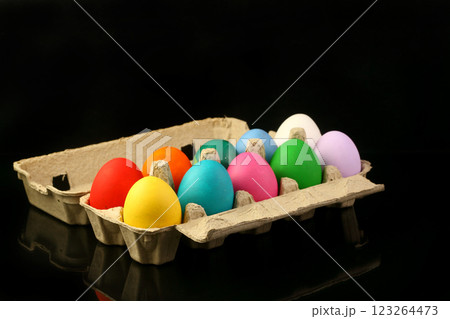 Easter festive multicolor eggs carton, black copy-space background 123264473