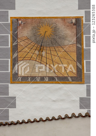 Sundial of the wall of a church, Kajov, Czechia 123265388