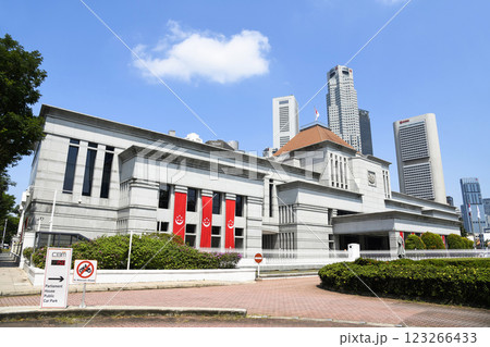 View of the Singapore Parliament House, a public building and a cultural landmark on the bank of the Singapore River, with a background of Financial District skyscrapers. View of the Singapore Parliament House, a public building and a cultural landmark on the bank of the Singapore River, with a background of Financial District skyscrapers. 123266433