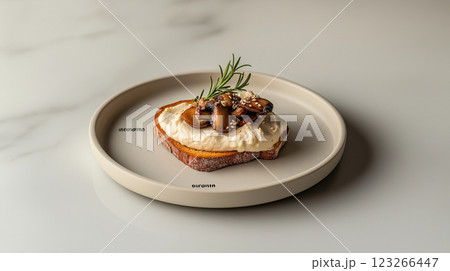 Whole grain toast topped with hummus, sauteed mushrooms, rosemary, egg white foam, sesame seeds, and tahini sauce on a sleek marble surface. Soft lighting enhances textures. Whole grain toast topped with hummus, sauteed mushrooms, rosemary, egg white foam, sesame seeds, and tahini sauce on a sleek marble surface. Soft lighting enhances textures. 123266447