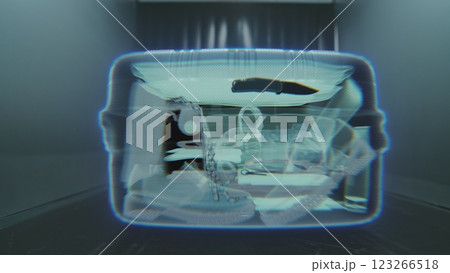 VFX Animation Visualizing Inside the Suitcase Illuminated by X-ray Metal Detector Scanning VFX Animation Visualizing Inside the Suitcase Illuminated by X-ray Metal Detector Scanning 123266518
