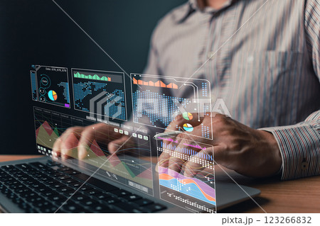 man use laptop with growth graphs and progress of business and analyze finance, and investment.Use technology to plan strategy to success goals and growth stock.online business, online marketing. 123266832