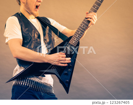 Man playing rock on electric guitar 123267405