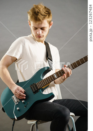 Man playing on electric guitar Man playing on electric guitar 123267484