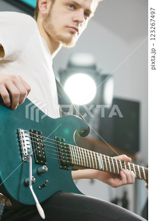 Man playing on electric guitar 123267497