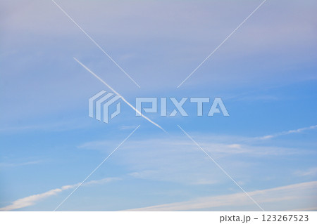 Blue sky with unique clouds. Plane trail on sky Blue sky with unique clouds. Plane trail on sky 123267523