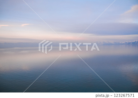 Beautiful sunset over the lake. Sunrise on the sea. Beautiful landscape with lake, mountains and sunset. Reflection in the water Beautiful sunset over the lake. Sunrise on the sea. Beautiful landscape with lake, mountains and sunset. Reflection in the water 123267571