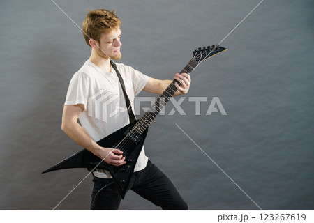 Man playing on electric guitar Man playing on electric guitar 123267619