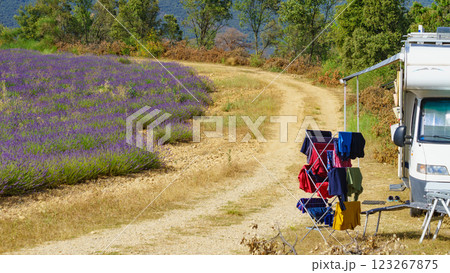 Clothes hanging to dry outdoors by camping car. Caravan vacation in France Clothes hanging to dry outdoors by camping car. Caravan vacation in France 123267875