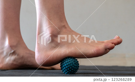 Blue spiky rubber massage ball for recovery massage. MFR ball for rehabilitation and health. 	 123268289