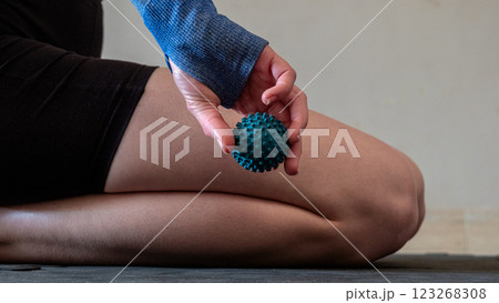 Blue spiky rubber massage ball for recovery massage. MFR ball for rehabilitation and health. Blue spiky rubber massage ball for recovery massage. MFR ball for rehabilitation and health. 123268308