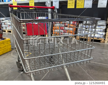 Shopping cart awaits adventurous shoppers in a bustling store environment 123268491