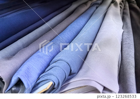 Fabrics in various shades of blue displayed in an elegant arrangement 123268533