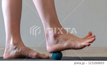 Blue spiky rubber massage ball for recovery massage. MFR ball for rehabilitation and health. 	 123268603