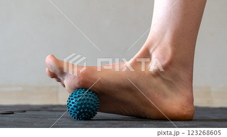 Blue spiky rubber massage ball for recovery massage. MFR ball for rehabilitation and health. 	 123268605