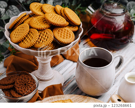 Delicious cookies served with tea and coffee on a cozy table 123268661