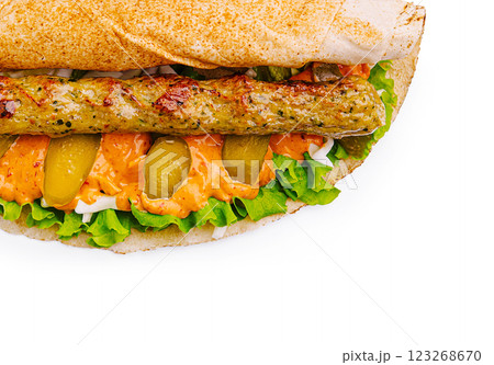 Delicious sandwich with grilled sausage and fresh vegetables 123268670