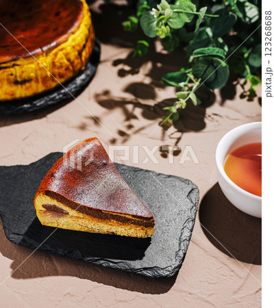 Delicious cheesecake served with tea on a rustic table 123268688