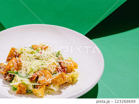 Fresh shrimp salad served in a white bowl on vibrant background Fresh shrimp salad served in a white bowl on vibrant background 123268689