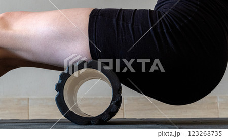 Black MFR roller for body. Recovery massage. MFR roll for rehabilitation and health. 123268735